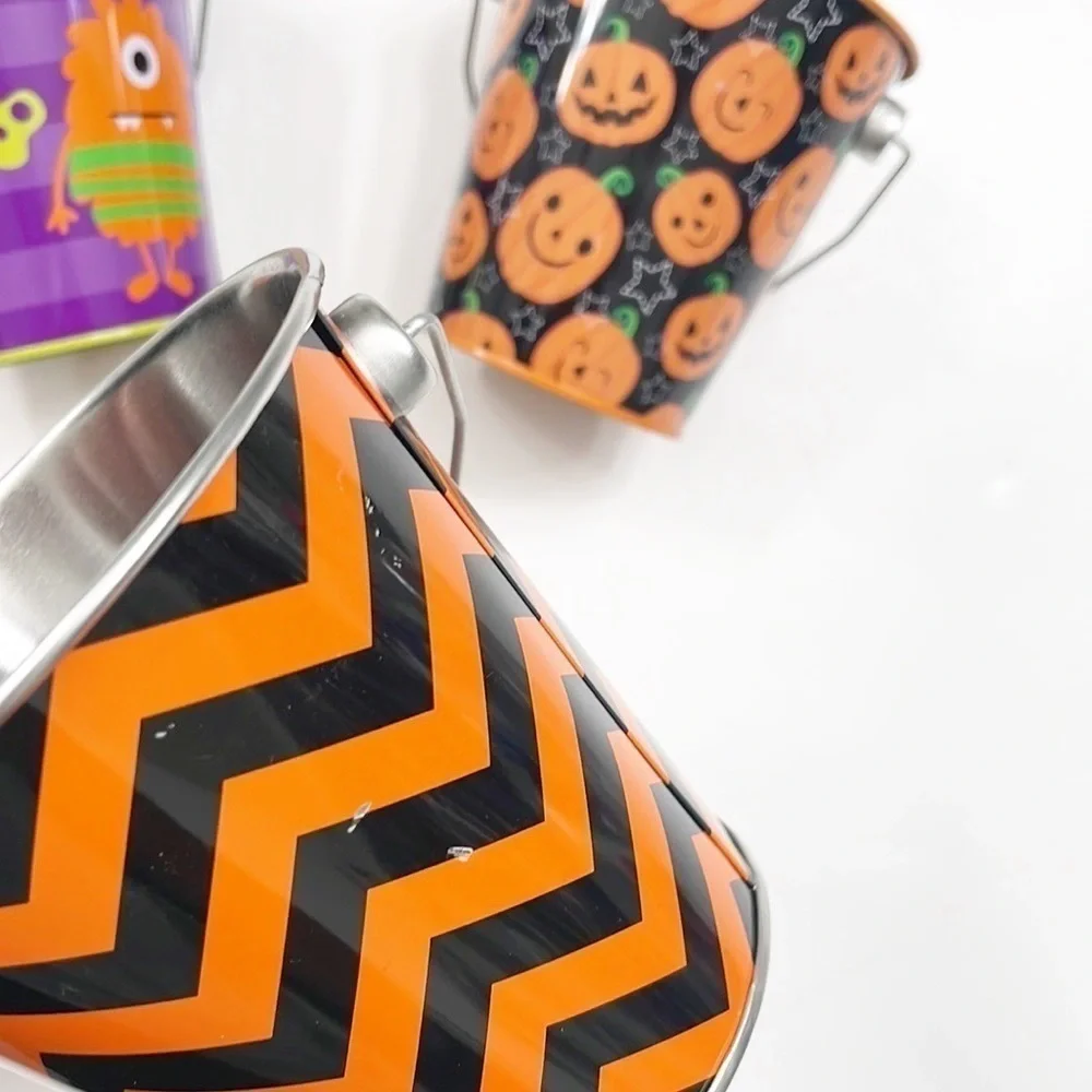 Set of 4 small Halloween/monster print metal pails - 4 inch